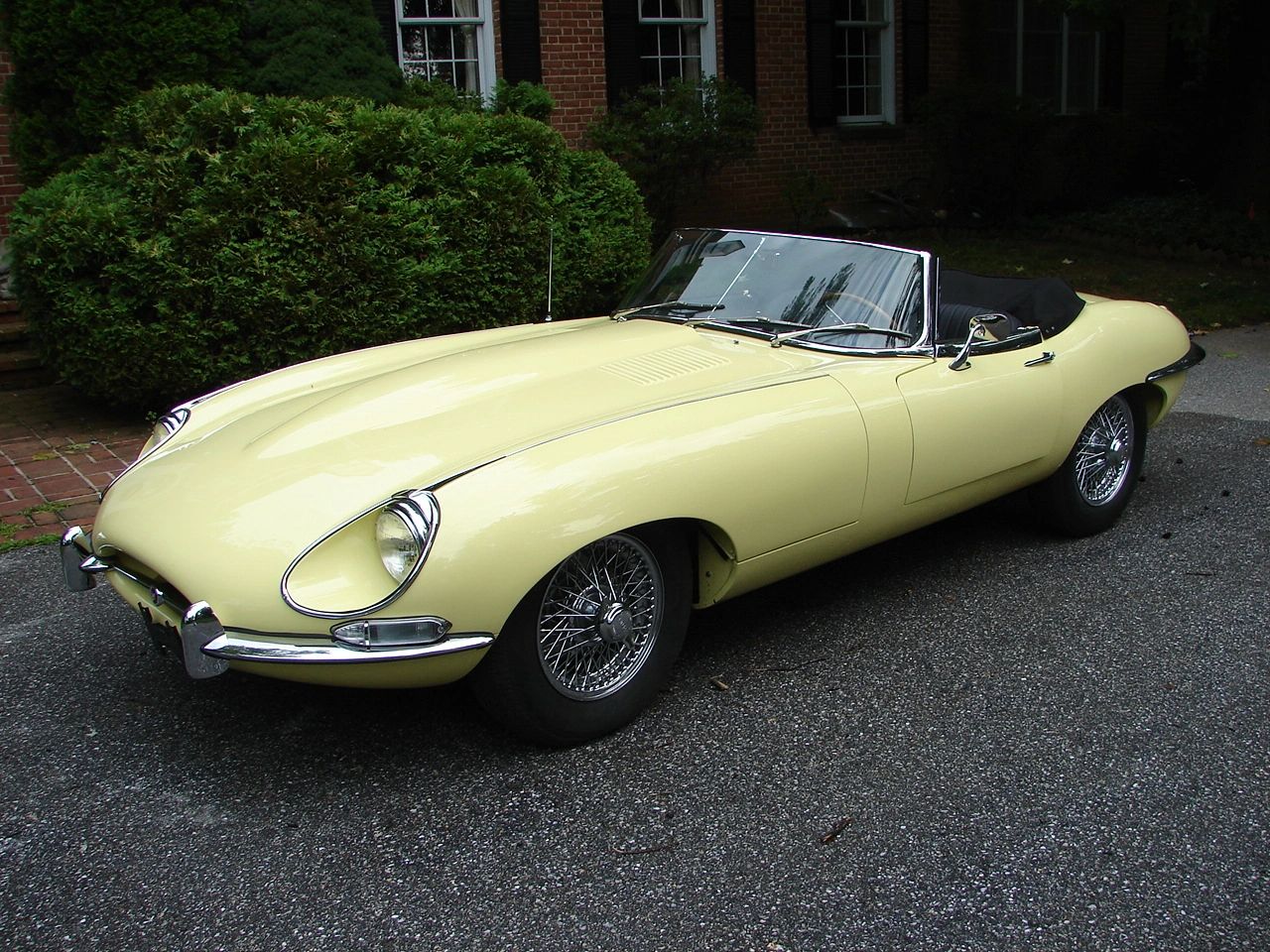 Pale yellow vintage Jaguar E-Type